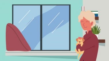 Adam evde köpek kaldırıyor.