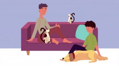Kedili ve köpekli adamlar oturma odasında.