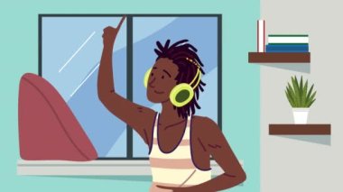 Afro genç adam evde müzik dinliyor.