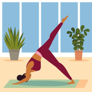 Kız evde yoga yapıyor.