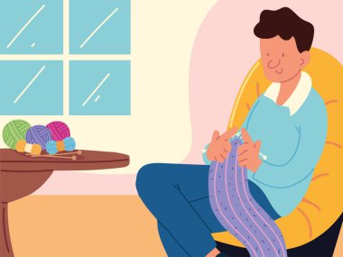 man in home knitting
