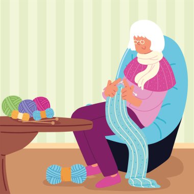Büyükanne eşarp örüyor.