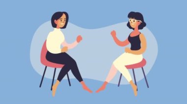 Sandalyelerde oturan genç kadınlar konuşuyor.