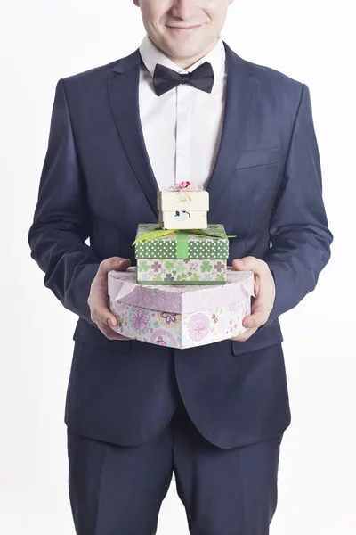 Business man with gifts (vertical image) — Stock Photo, Image