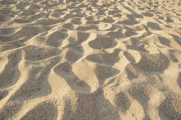 Песчаный фон на пляже — стоковое фото