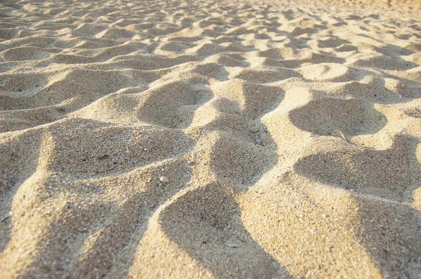 Zand achtergrond op het strand — Stockfoto