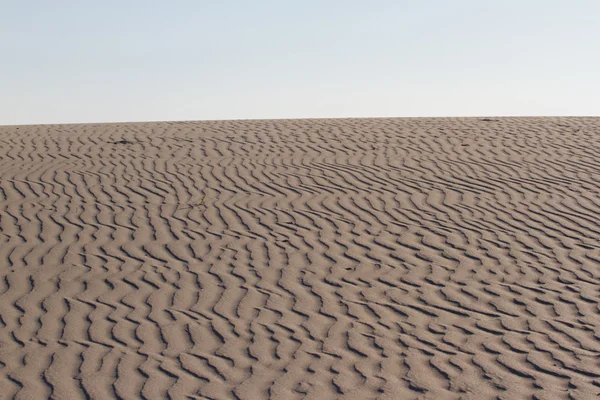 Background of sand texture. Wavy texture