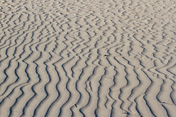 Fundo de textura de areia. Textura ondulada — Fotografia de Stock