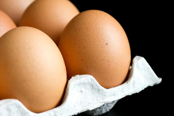 Whole eggs in cardboard tray. — Stock Photo, Image