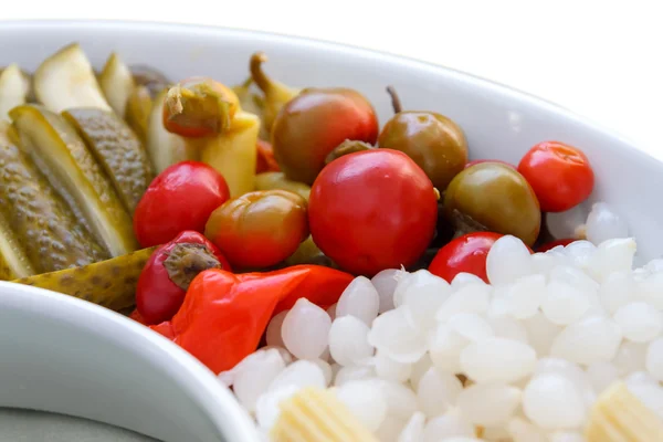 Mixed pickles, onions, peppers, and chillies. — Stock Photo, Image