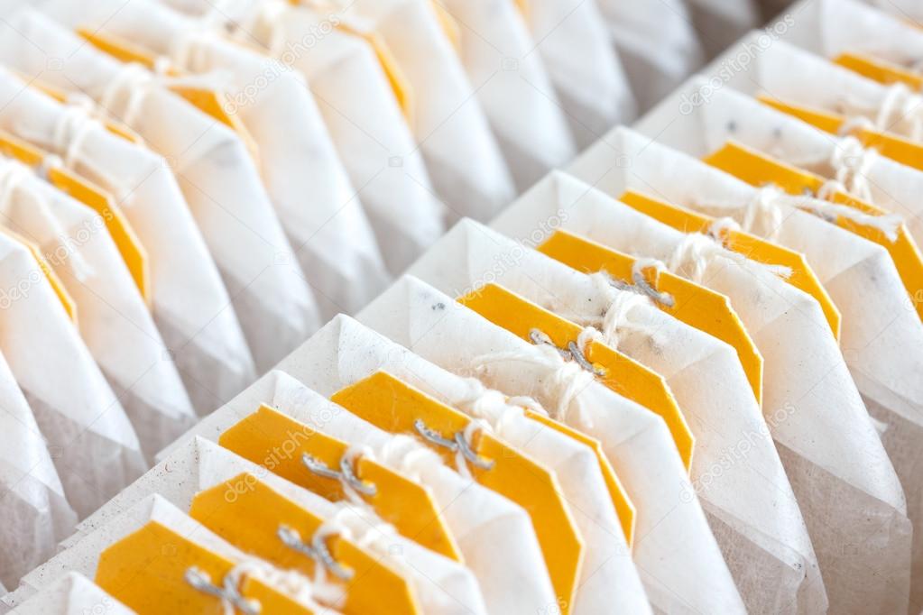 Detail of packed yellow tagged tea bags