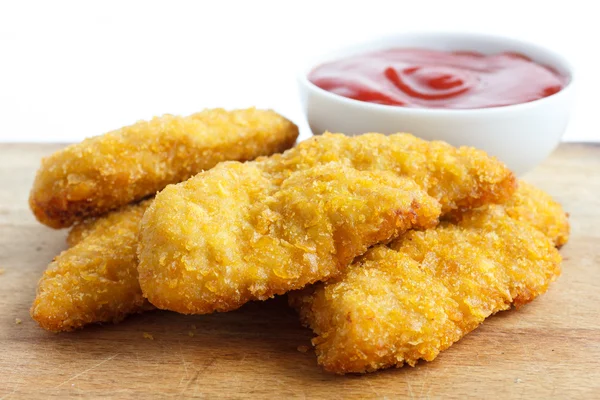 Golden fried bread crumbed chicken strips. — Stock Photo, Image