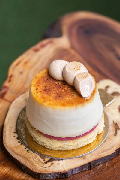 Creme brulee mini cheesecake tart on live edge wood