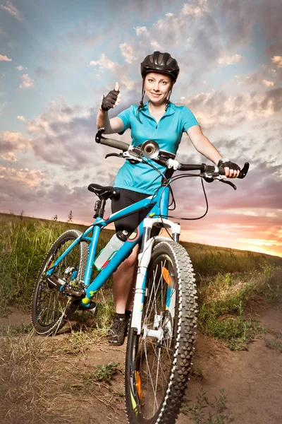 Woman on the bike — Stock Photo, Image