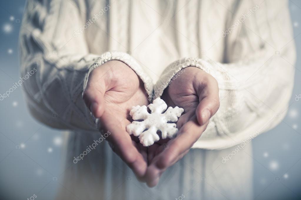 Snowflake in hands