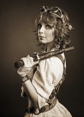 Güzel Dişileştirilmiş steampunk kız silahla kameraya bakıyor. Eski