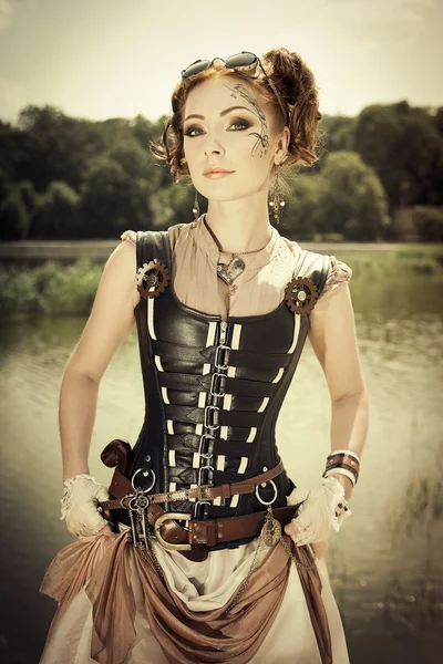 Beautiful steampunk redhair woman with body art on her face outd — Stock Photo, Image