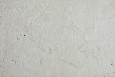 Eski beyaz alçı dokusu, kusurların yakın çekimi.