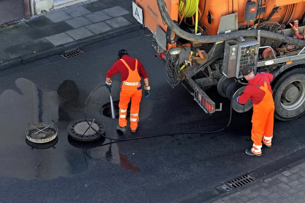 Sewer cleaning. — Stock Image Sewer cleaning. Royalty Free Stock Photos