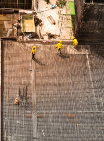 Abstract blur aerial view of construction worker in construction site ,abstract blur background