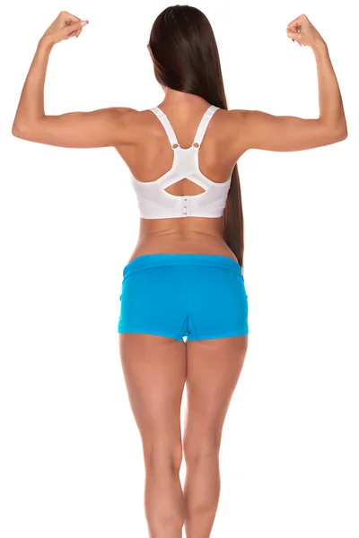 Fitness-Frau steht vor isoliertem weißen Hintergrund — Stockfoto