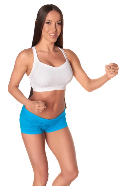 Mulher fitness de pé contra fundo branco isolado — Fotografia de Stock