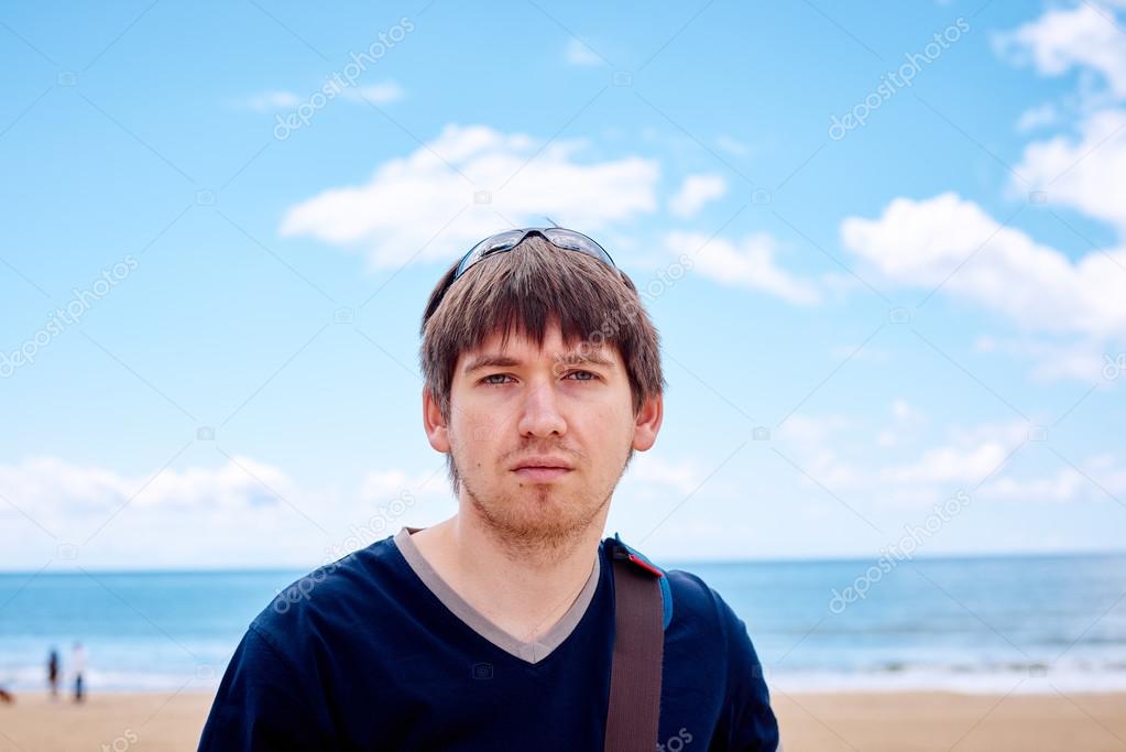 Stylish man on the beach