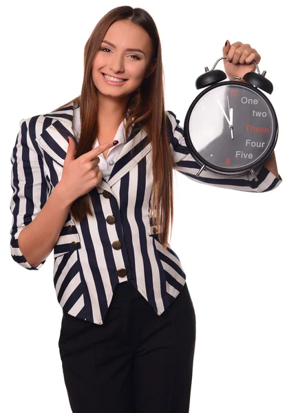 Escritório menina mostrando relógio isolado em um fundo branco — Fotografia de Stock