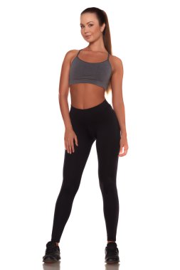 Fitness kadın spor stil ayakta izole beyaz arka plan karşı
