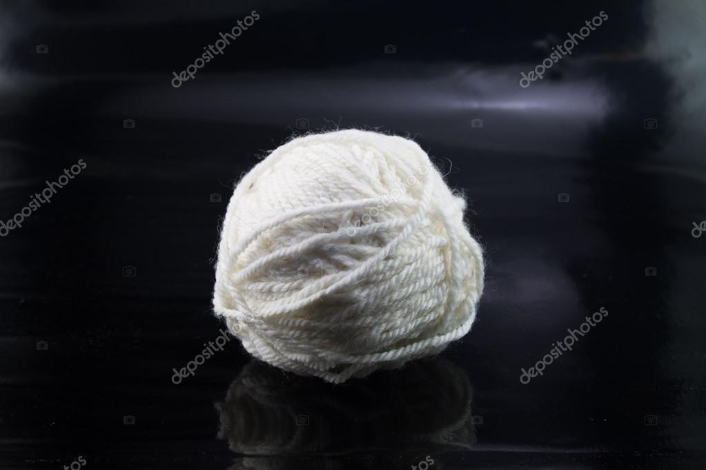 The white ball of wool thread on a black background Stock Photo by ...