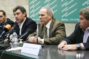 Politician Garry Kasparov speaks at a press conference the opposition clipart