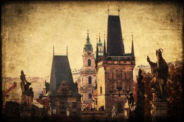 vintage style picture of old towers at the famous Charles Bridge in Prague, Czech Republic