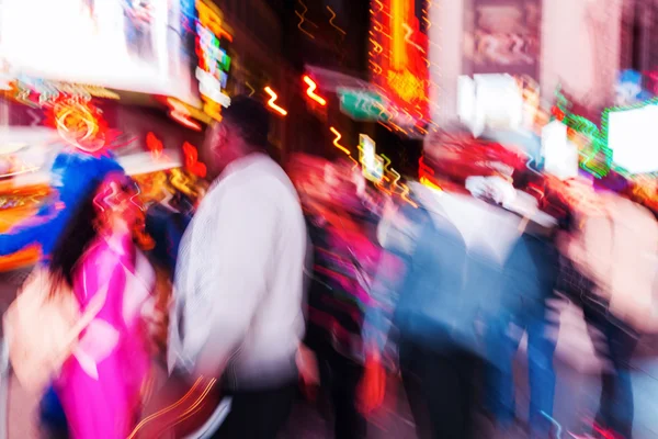 abstract blurred picture of people in NYC, Manhattan, at night