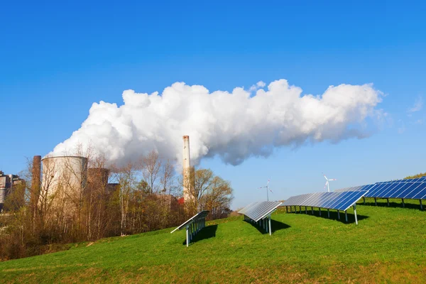 Solar collectors and fossil-fuel power station — Stock Photo, Image