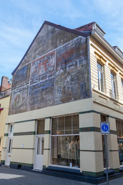 Historisk annonce på en husmur i Valkenburg aan de Geul, Holland - Stock-foto