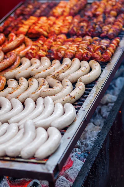Grill with bratwurst and skewers — Stock Photo, Image