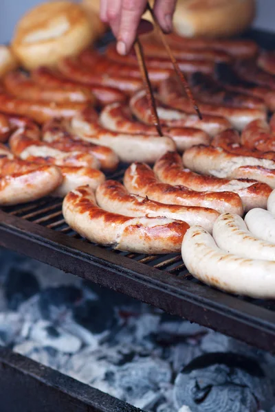 Bratwurst on a large grill — Stock Photo, Image