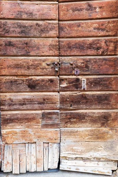 Foto de uma porta de madeira antiga — Fotografia de Stock