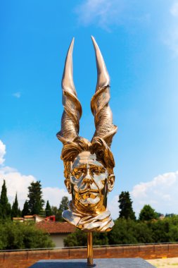 golden sculpture at the Forte di Belvedere in Florence, Italy clipart