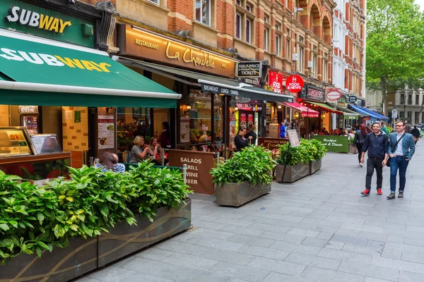 Irving street with restaurants in London, UK