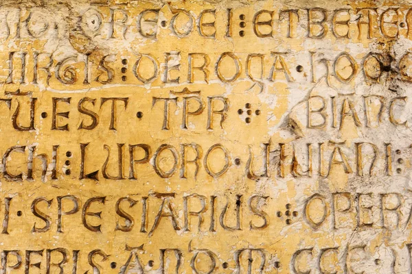 Ancient latin script on a house wall in Florence — Stock Photo, Image