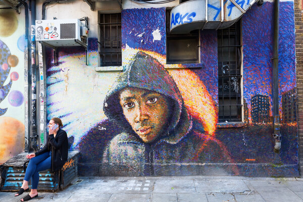 mural art on a wall in the city of London, UK