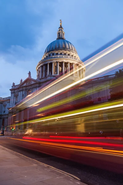 Light trails of buses at the St Pauls Cathedral in London Royalty Free Stock Photos