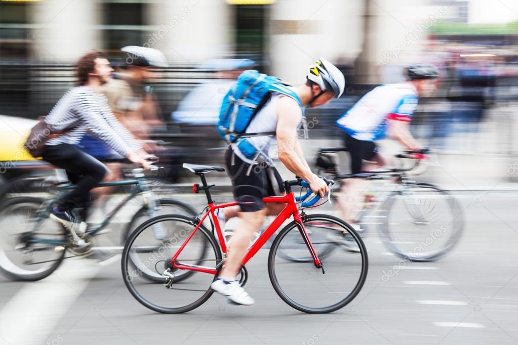 Cyclists on a city street in motion blur