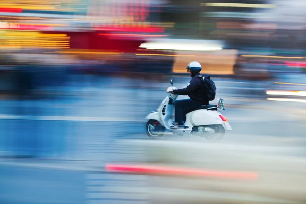 Scooterist in motion blur — Stock Photo, Image