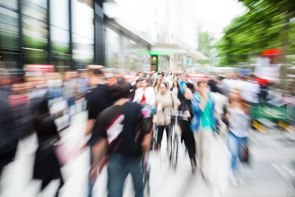 Zoom picture of shopping people on the move in the city