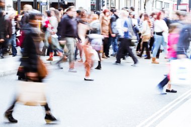 People in motion blur crossing a street in London City clipart