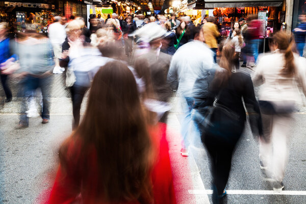 Crowd of people crossing a street