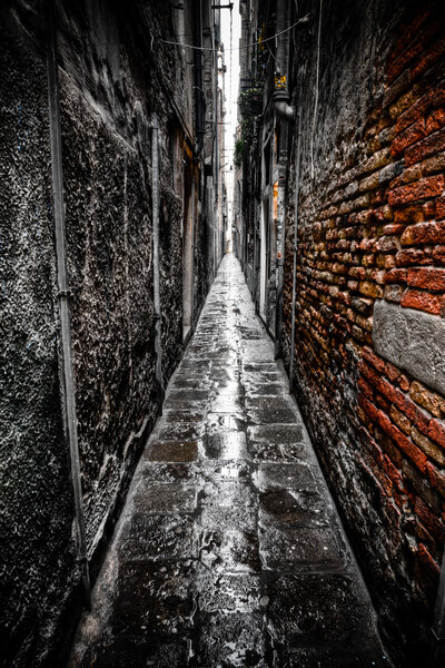 Dark alley in Venice, Italy