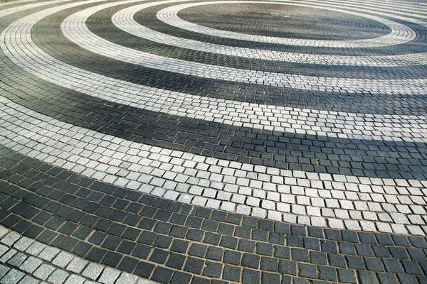 Padrões de círculo em um quadrado de paralelepípedos — Fotografia de Stock